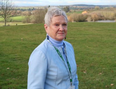 A photo of Sue Douthwaite, Vice-Chair EFC, and Past Master of the Loriners Company in a sporty light blue leather jacket